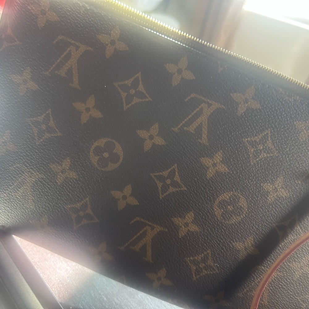 Authentic Louis Vuitton pouchette.  Smoke free home.  Excellent condition.